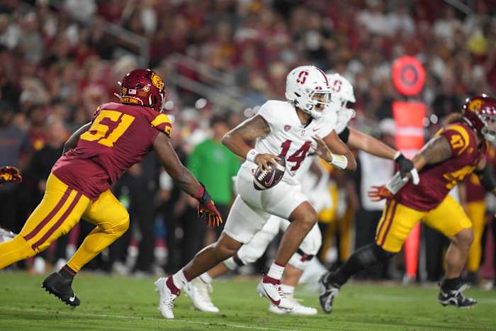 Sep 9, 2023; Los Angeles, California, USA; Stanford Cardinal quarterback Ashton Daniels (14) is pressured by Southern California Trojans defensive end Solomon Byrd (51) n the first half at United Airlines Field at Los Angeles Memorial Coliseum. Mandatory Credit: Kirby Lee-USA TODAY Sports